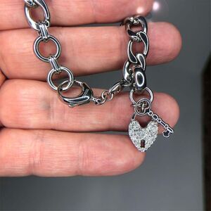 1103 Fossil  circle CZ steel heart cz key charm bracelet 7.5"
